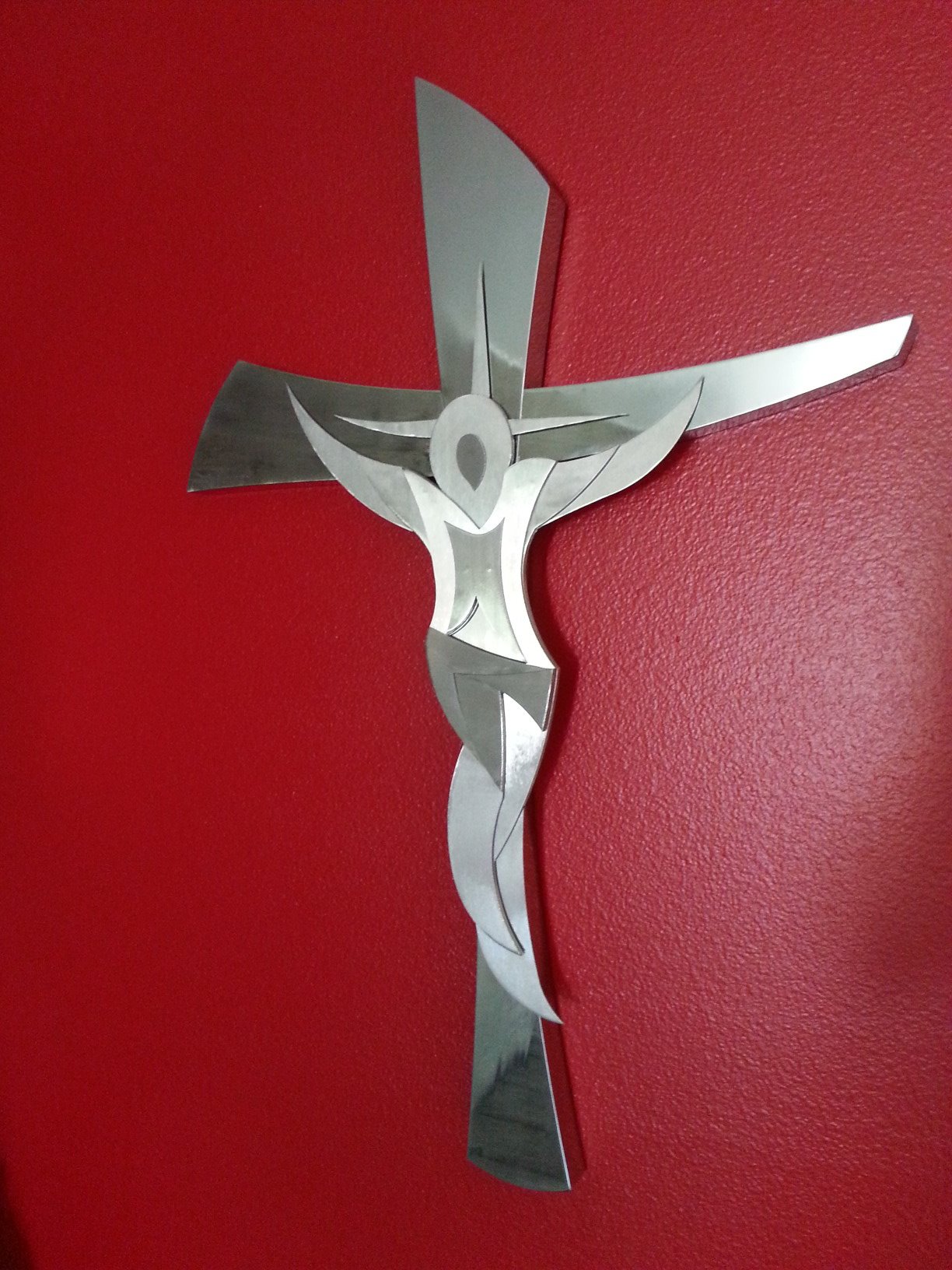 Polished stainless steel crucifix wall art — decorative metalwork Arizona