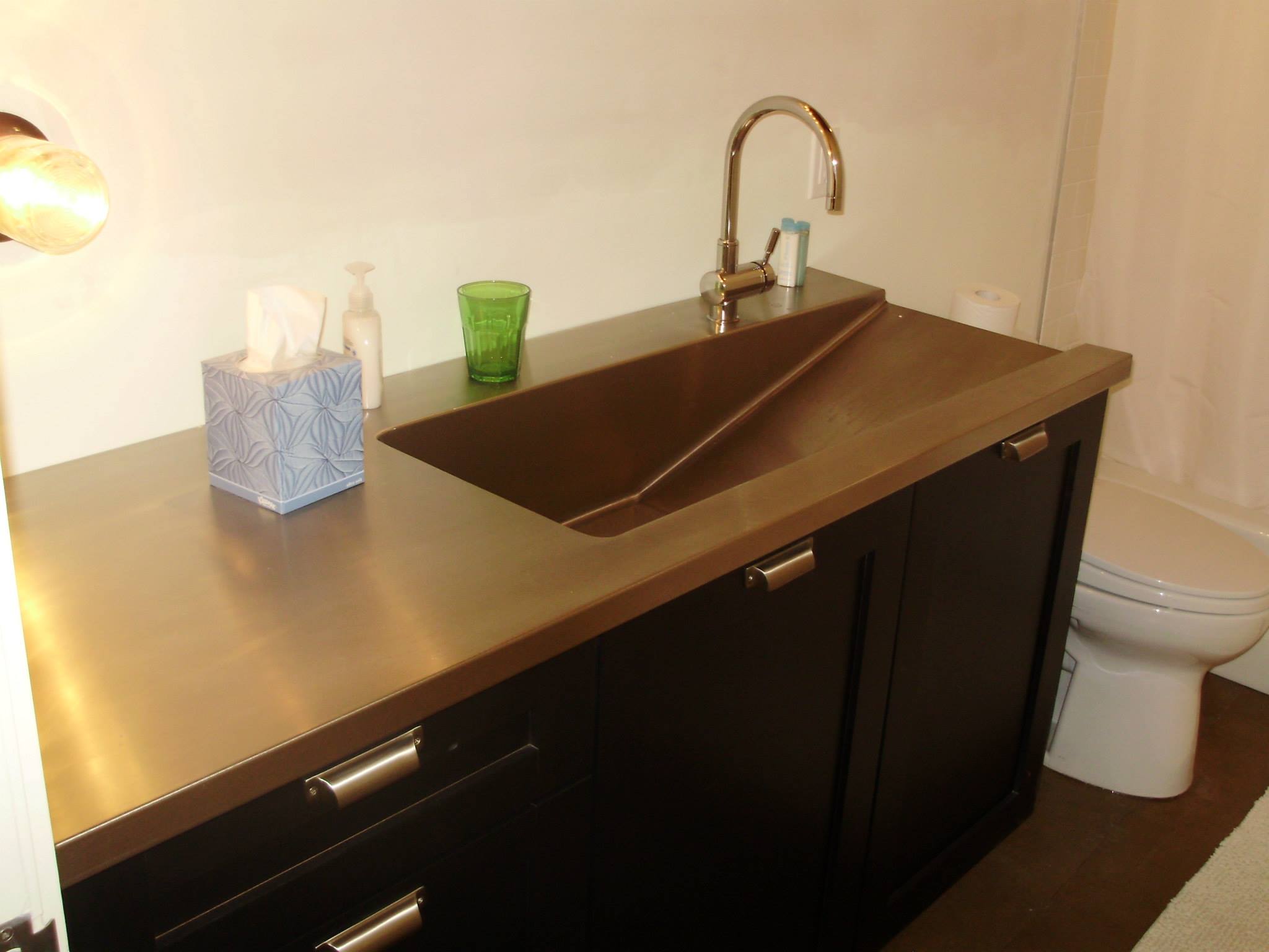 Hand-crafted copper bathroom vanity and integrated sink